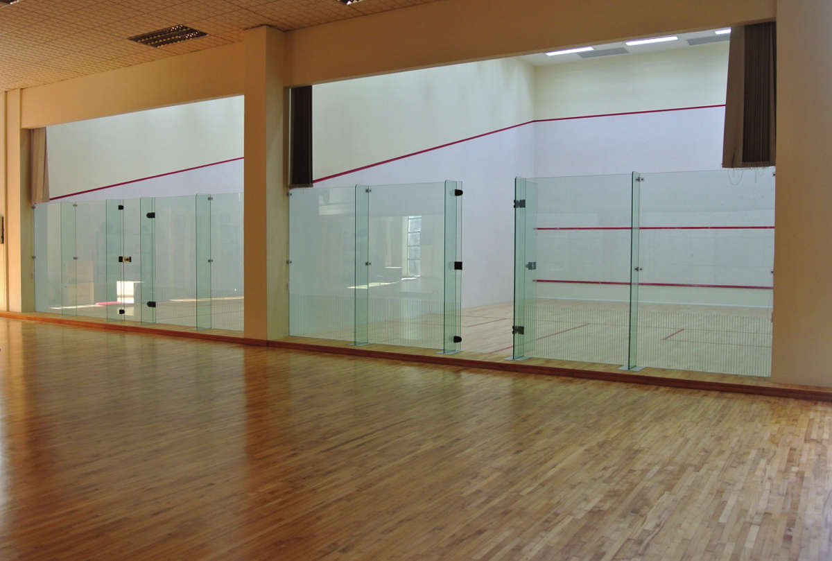 ACJC Squash Court - With Armourcoat specialist heavy duty walls, Junckers sports grade pre-finished timber flooring, and specialist glass walls and doors, to comply with necessary standards.