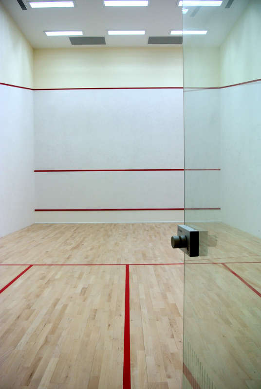 ACJC Squash Court - With Armourcoat specialist heavy duty walls, Junckers sports grade pre-finished timber flooring, and specialist glass walls and doors, to comply with necessary standards.