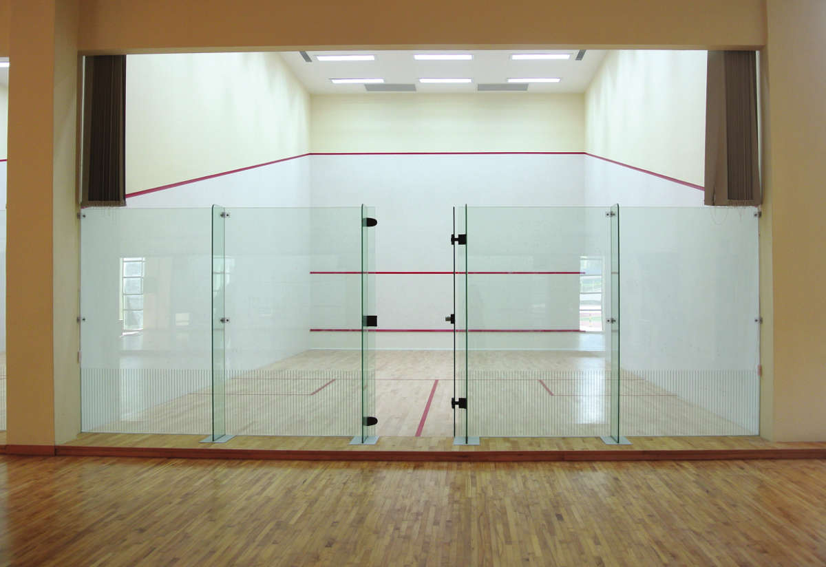 ACJC Squash Court - With Armourcoat specialist heavy duty walls, Junckers sports grade pre-finished timber flooring, and specialist glass walls and doors, to comply with necessary standards.