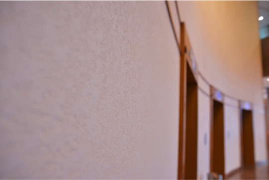 Holiday Inn Singapore Atrium- Lift Lobby wall with seamless Armourcoat Pitted finish.