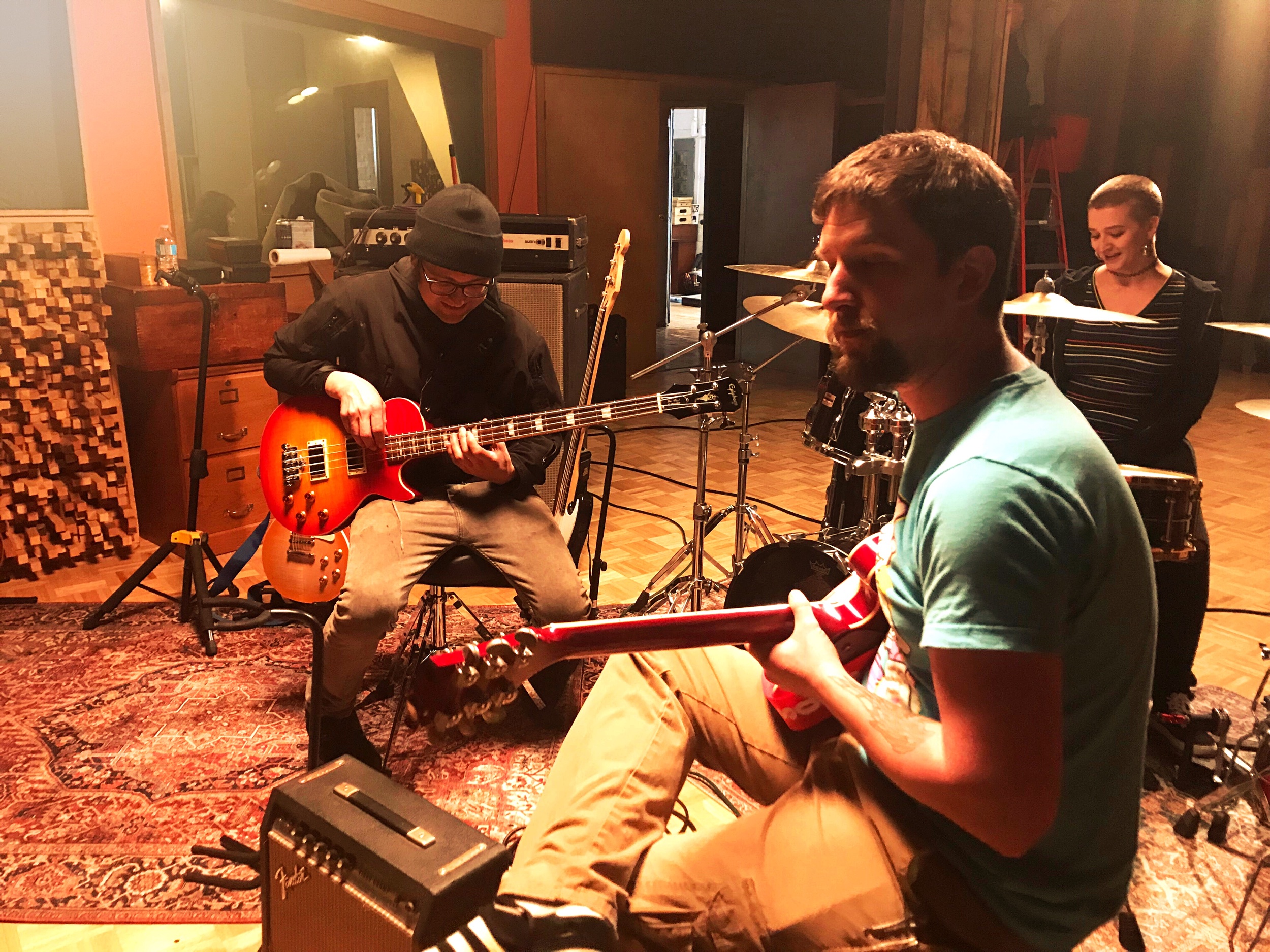 Local Cleveland creatives tuning & testing musical instruments used for filming The Garage featured in downtown Cleveland’s Rock & Roll Hall of Fame