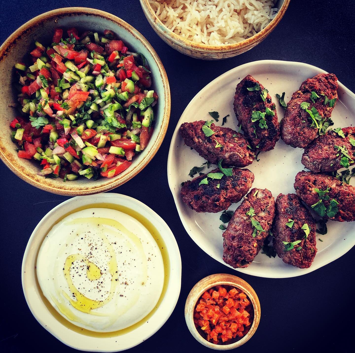 Sunday supper included kebabs made with ground #bison from Storsley Bison Farm, whipped feta made using @chaebanartisan soft feta and their #labneh with a drizzle of Persian Lime EVOO from @frescolio , cumin basmati rice and a tomato &amp; cucumber s