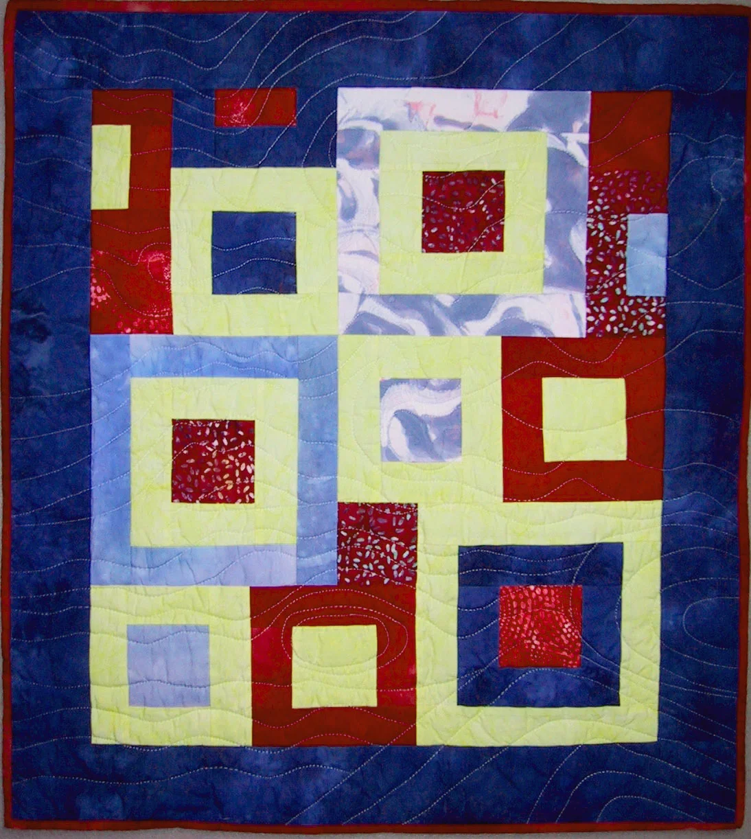 Floating Squares ©2003 · 28.5"L x 25.75"W · $250 Commercial and artist-dyed and painted cotton fabric Machine pieced and machine quilted
