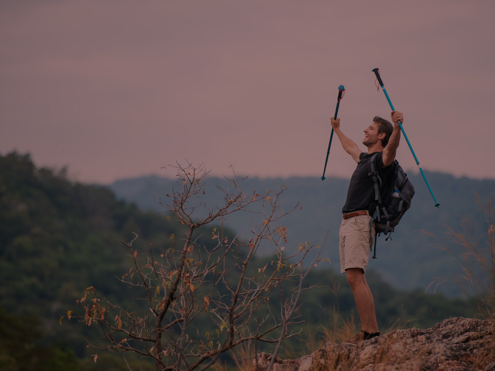 Man Hiking a Mountain