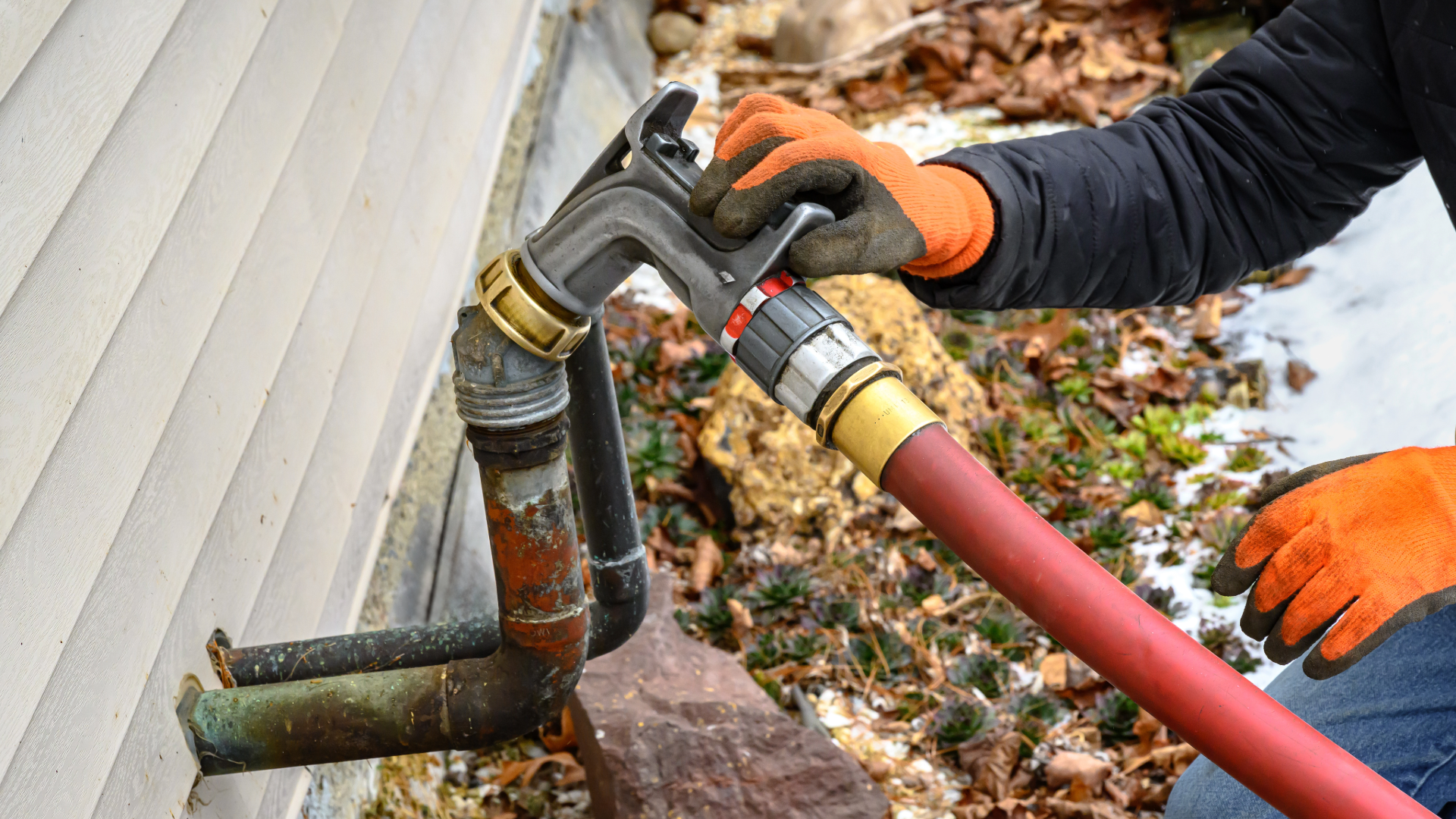 Heating oil hose connected to a spicket on home