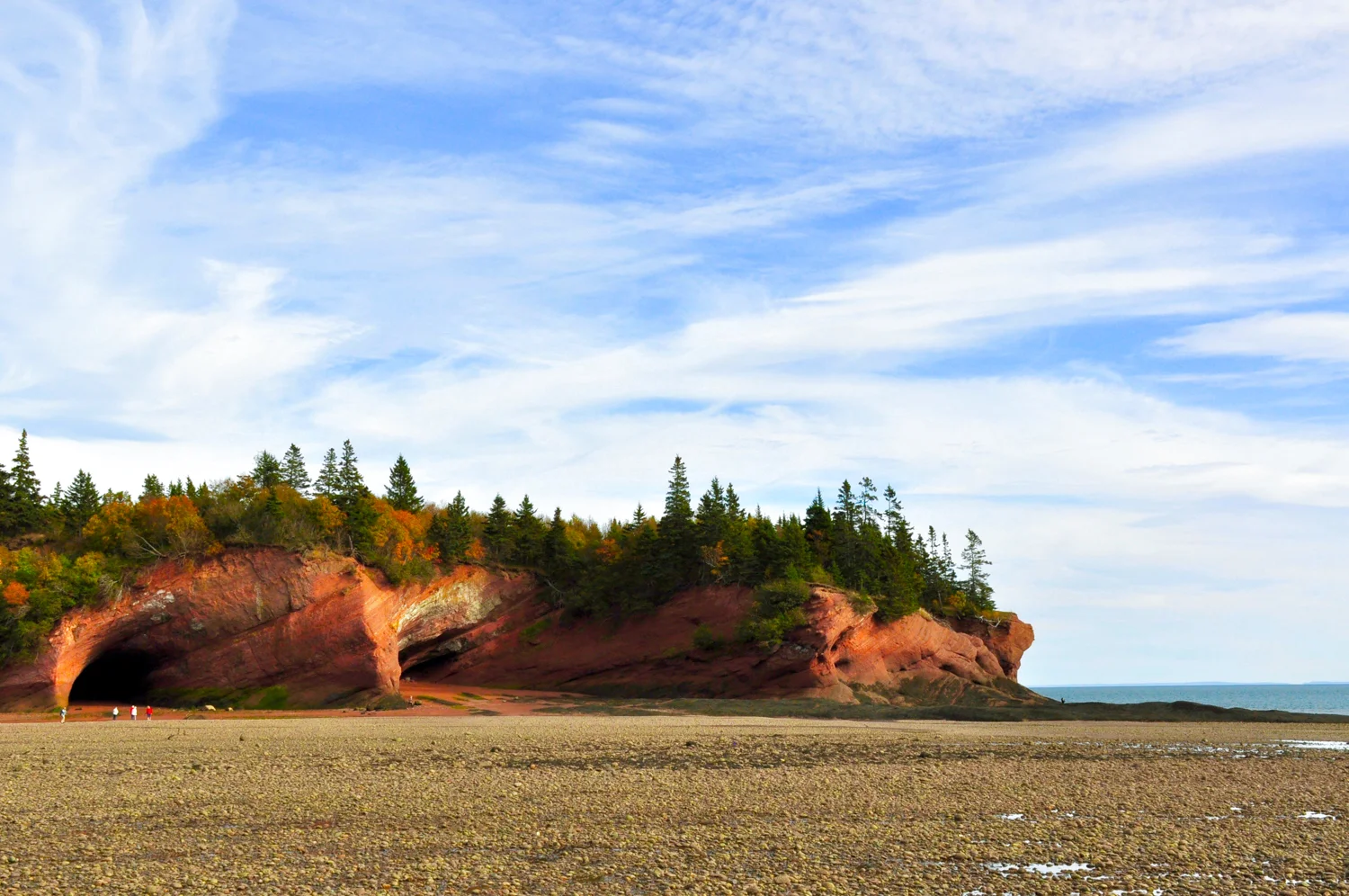 The Bay of Fundy Sea Caves are a sight worth driving out of your way for, and taking the time to sit and watch the tide pass. They are a UNESCO World Heritage Site, and for scale the red dots on the left are people.
