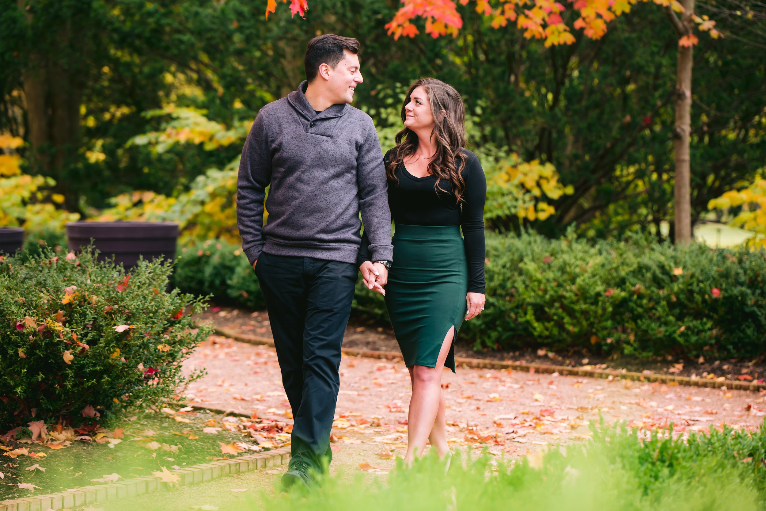 Couple walking and looking at each other - Engagement Photography in Wheaton IL