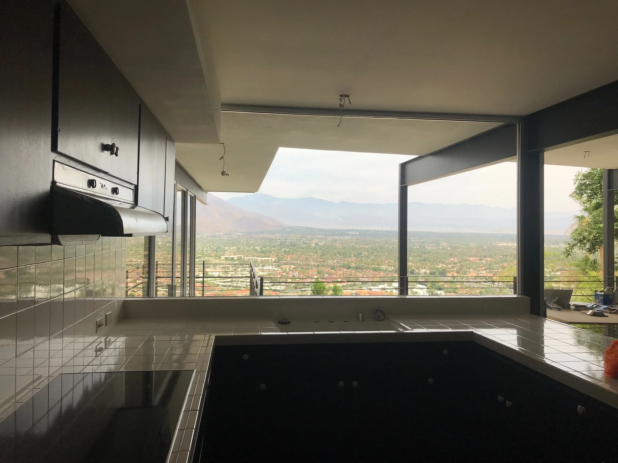The kitchen (mid restoration), open to the family room and the view.