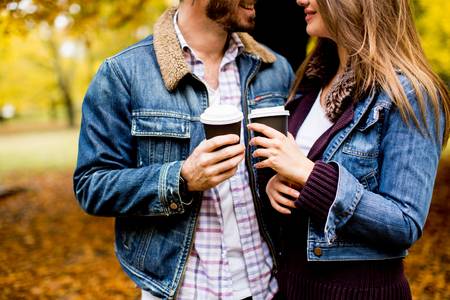 65332919-portrait-of-a-happy-romantic-couple-with-coffee-walking-outdoors-in-the-autumn-park.jpg