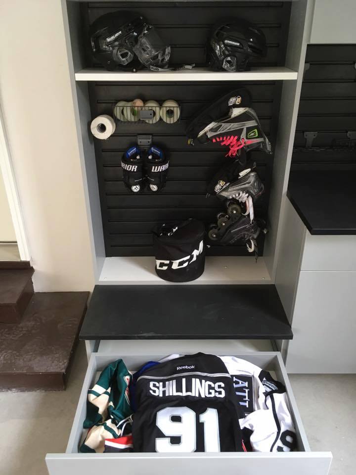 hockey gear in cabinet with drawer.jpg