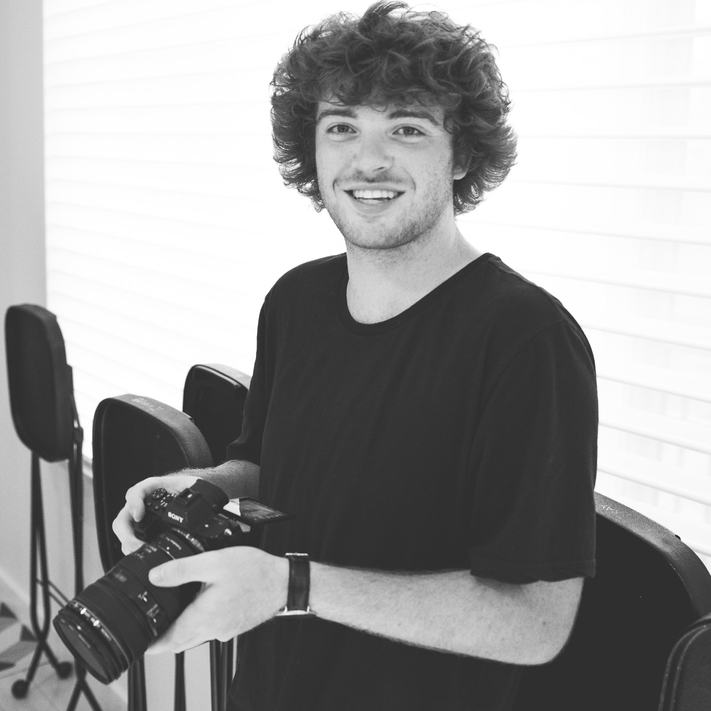 Jake Lamons of the Vativ Media team holding his Sony 4k camera while doing a film job.