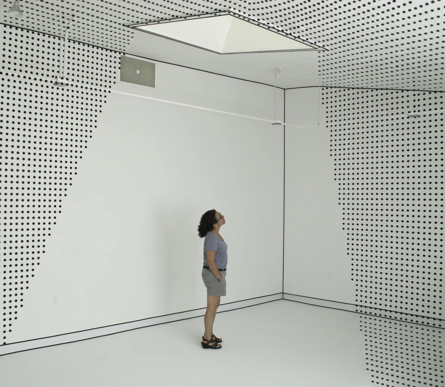 room with sky light (and sloped ceiling), tape, and vinyl sign film