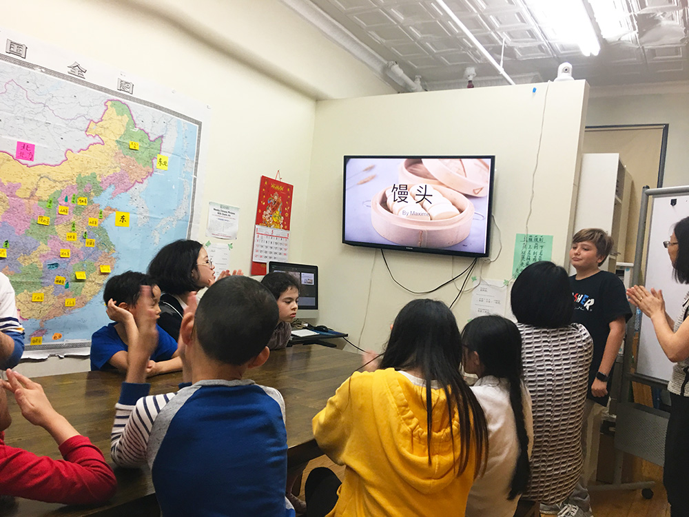  A student doing a presentation on “mantou” (steamed buns).  