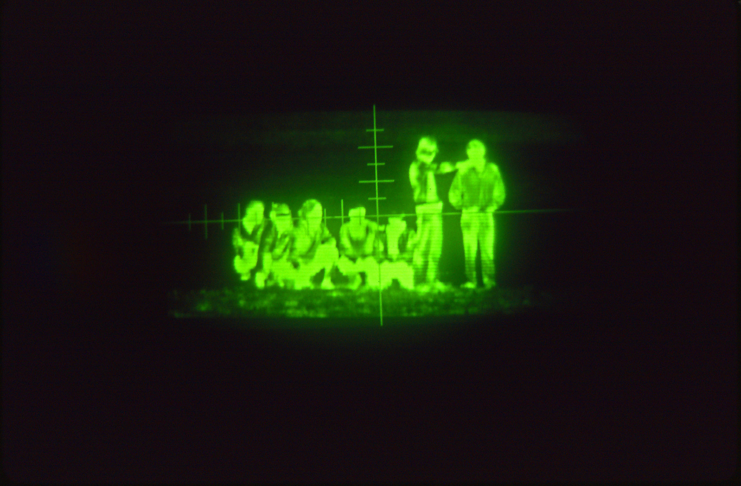 Undocumented Mexican immigrants waiting to cross the U.S.-Mexico border at Otay Mesa as seen in a border patrol night scope.