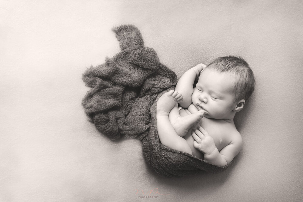 Newborn boy sleeping by NP Photography