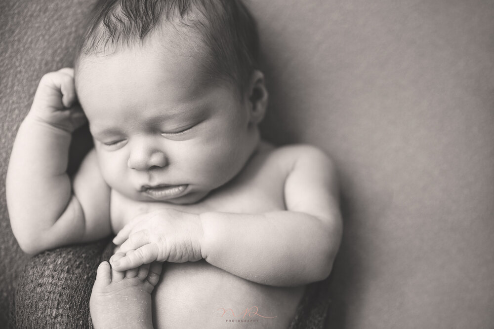 Photo shoot of newborn baby boy sleeping by NP Photography