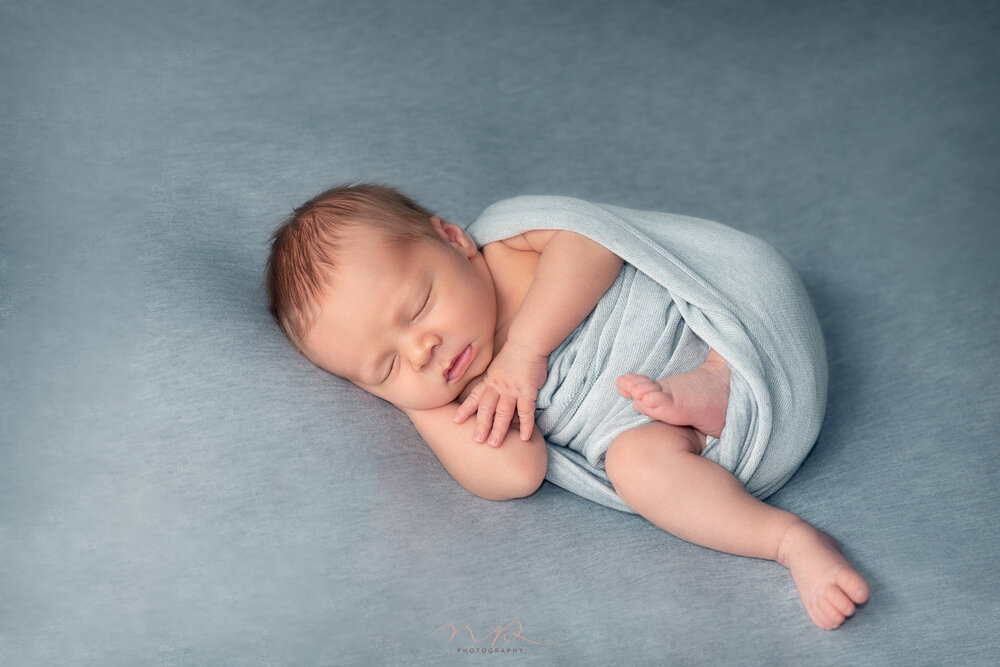 Photo shoot of newborn baby boy sleeping by NP Photography