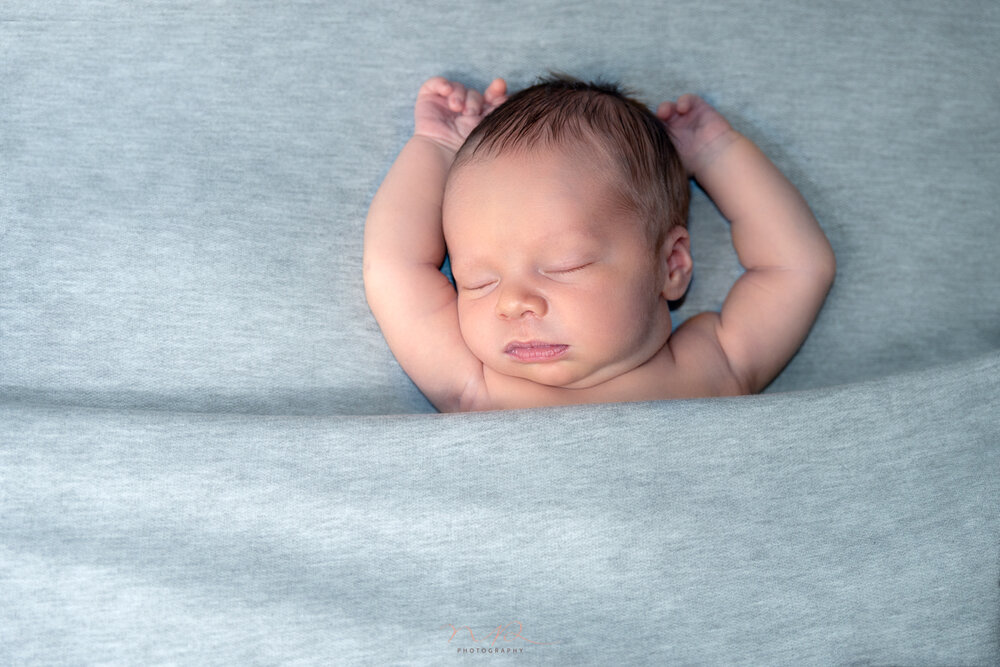 Photo shoot of newborn baby boy sleeping by NP Photography