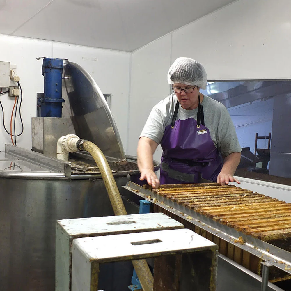 Sonia loading the extractor ready for spinning