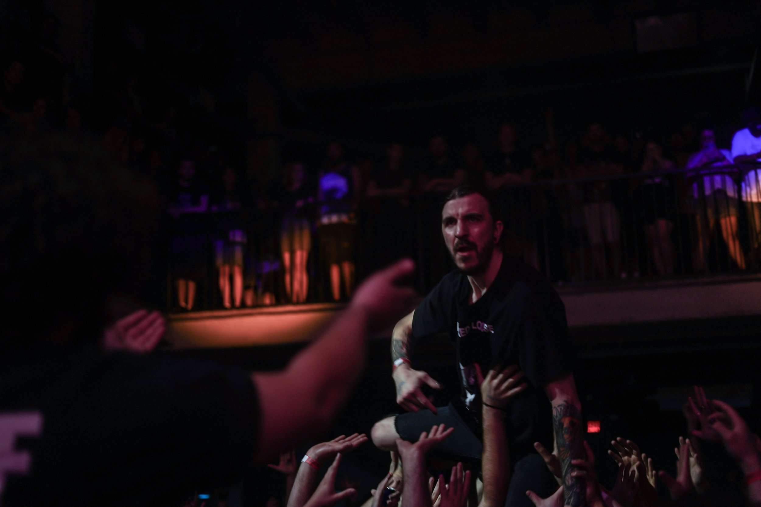 A fan crowd surfs to Alpha Wolf at The Masquerade