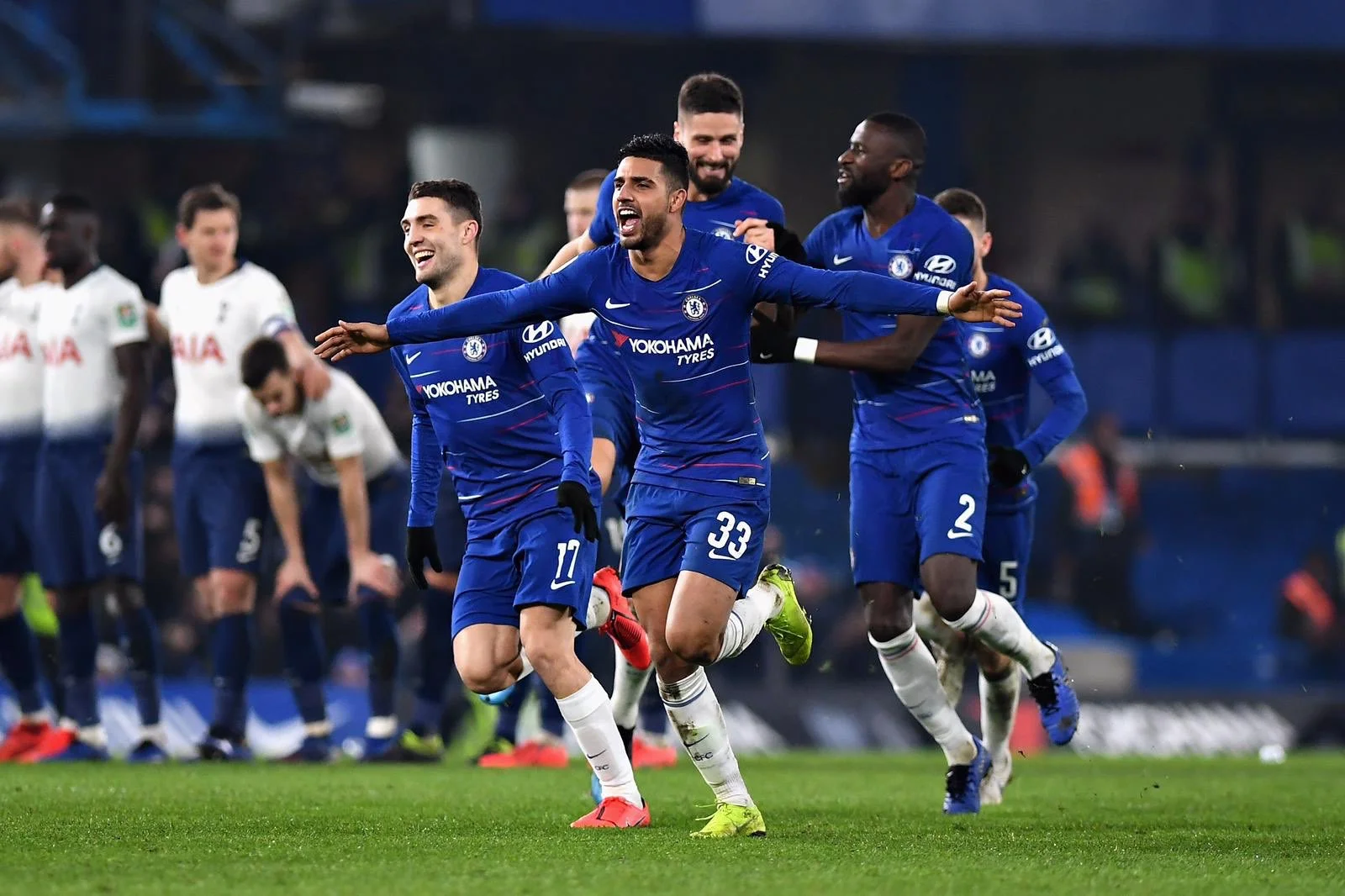 Emerson leads the celebration after Chelsea beat Spurs on penalties.