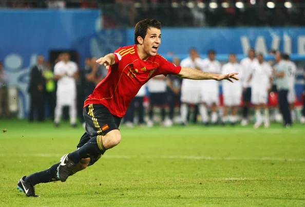 Fabregas wheels away in celebration.