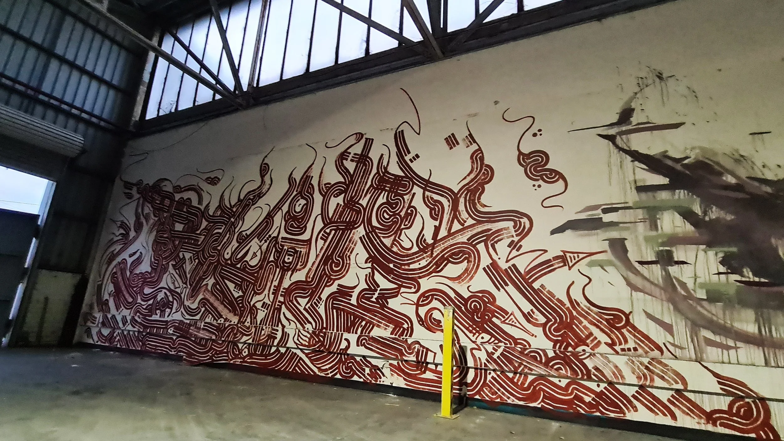 Big Red Multiroller, Port Melbourne: Port Melbourne mural by Melbourne graffiti artist Bailer, featuring a large-scale red Multiroller piece with bold single-colour linework.