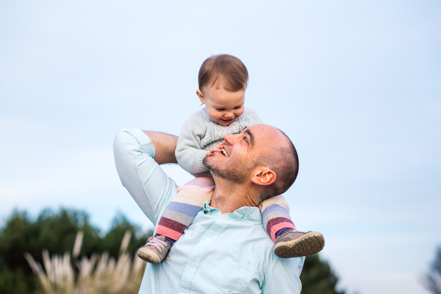 Dad standing with one year old baby girl on his shoulders {East Bay Baby Photographer}