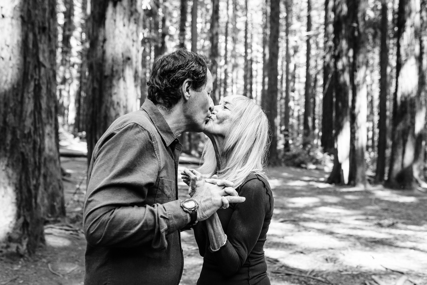 black and white of an older couple kissing in the the woods {East Bay Family Photographer}