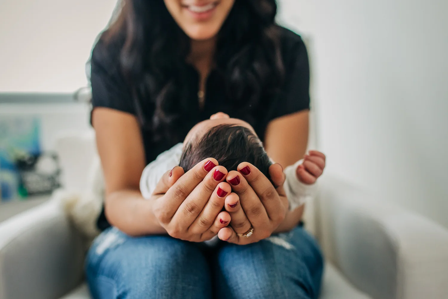 Mom cradling baby's head in her hands | San Francisco Newborn Photographer