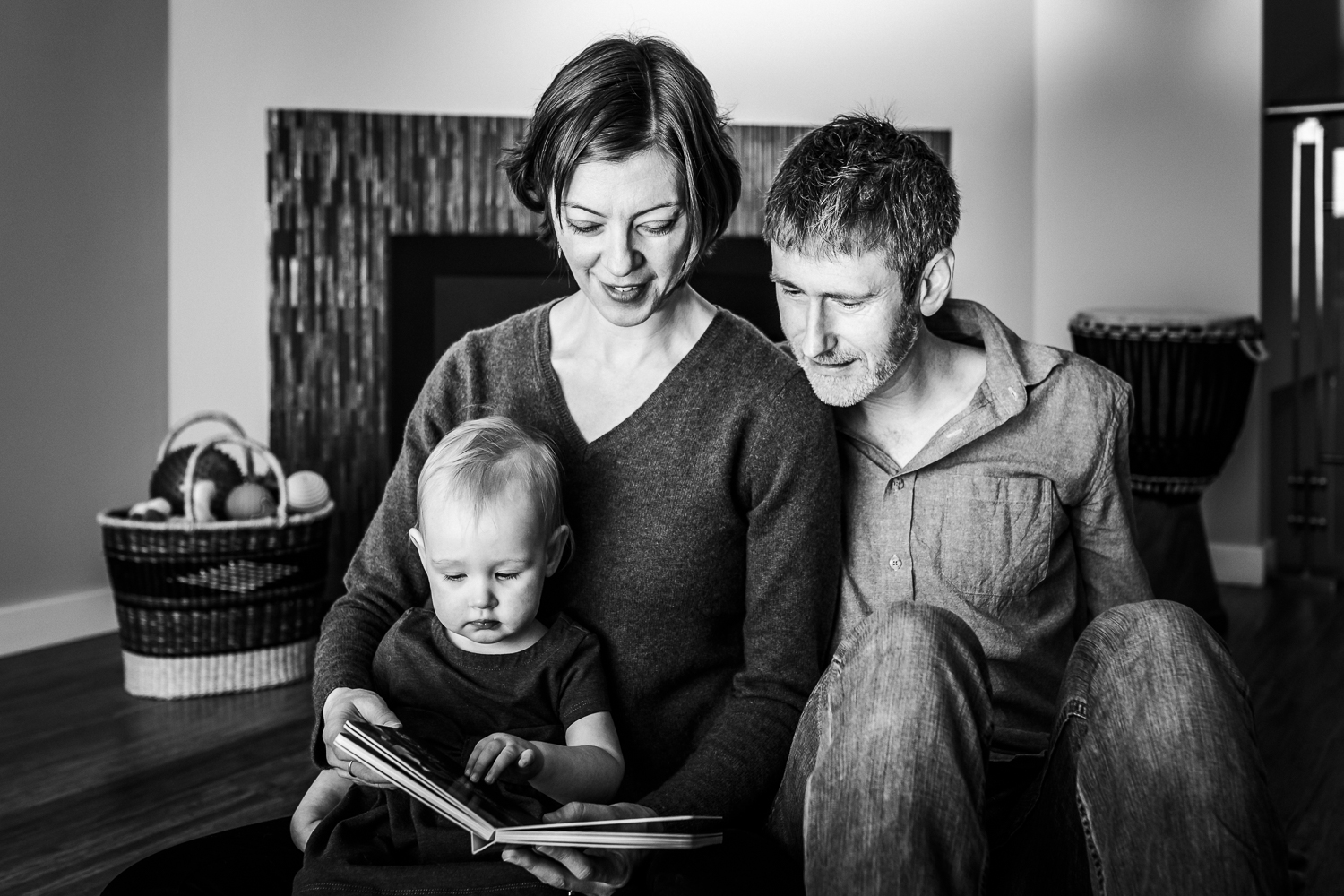 Parents reading a book together with their toddler | SF Baby Photographer