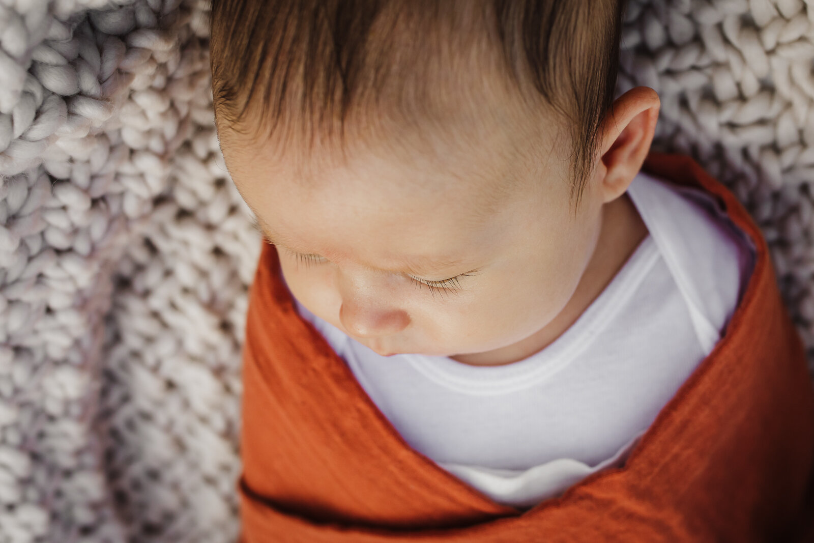 angled portrait of new baby boy swaddled - San Francisco Bay Area Newborn Photographer
