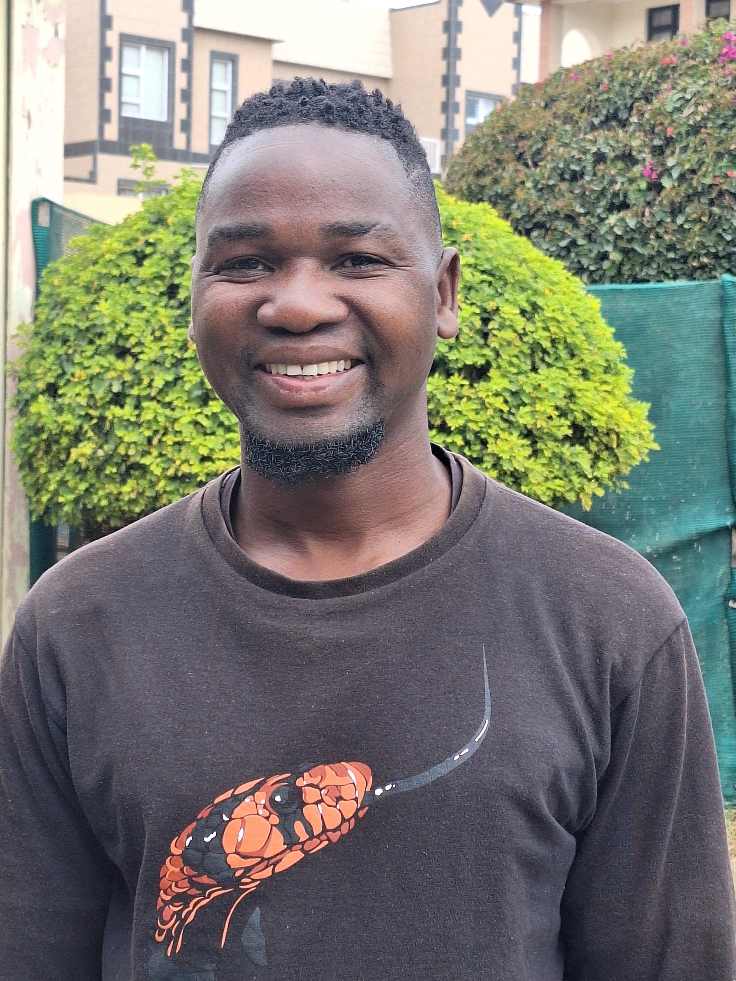 Leonard working for the Living Desert Snake Park in Swakopmund, Namibia. Snake conservation and education. Many snake species on display. Learn about Namibia's fascinating reptiles. Black mambas, cobras and adders.