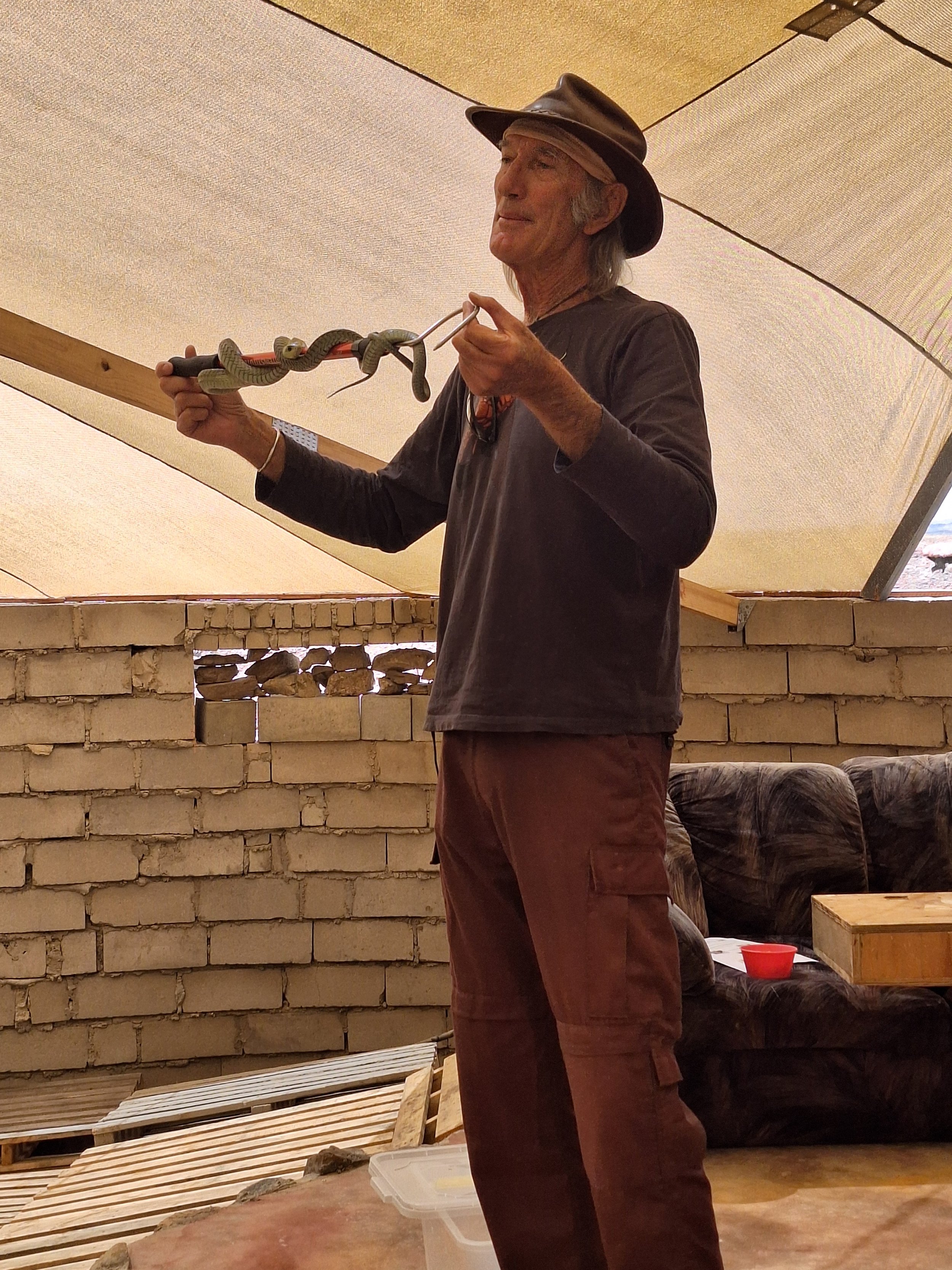 Stretch giving a snake demonstration to a group of environmental assessment professionals at their annual conference. Snake and reptile education for schools, tourists and corporations. Safe snake handling lessons. Black mambas, cobras and adders.