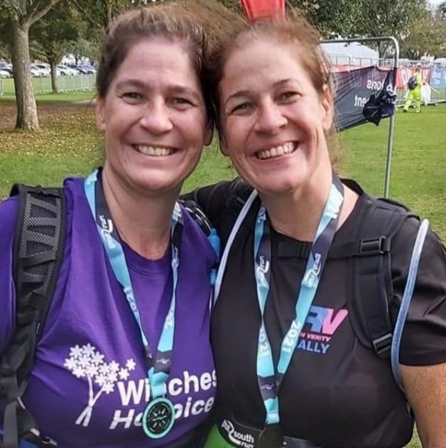  Two people smiling after completing a run 