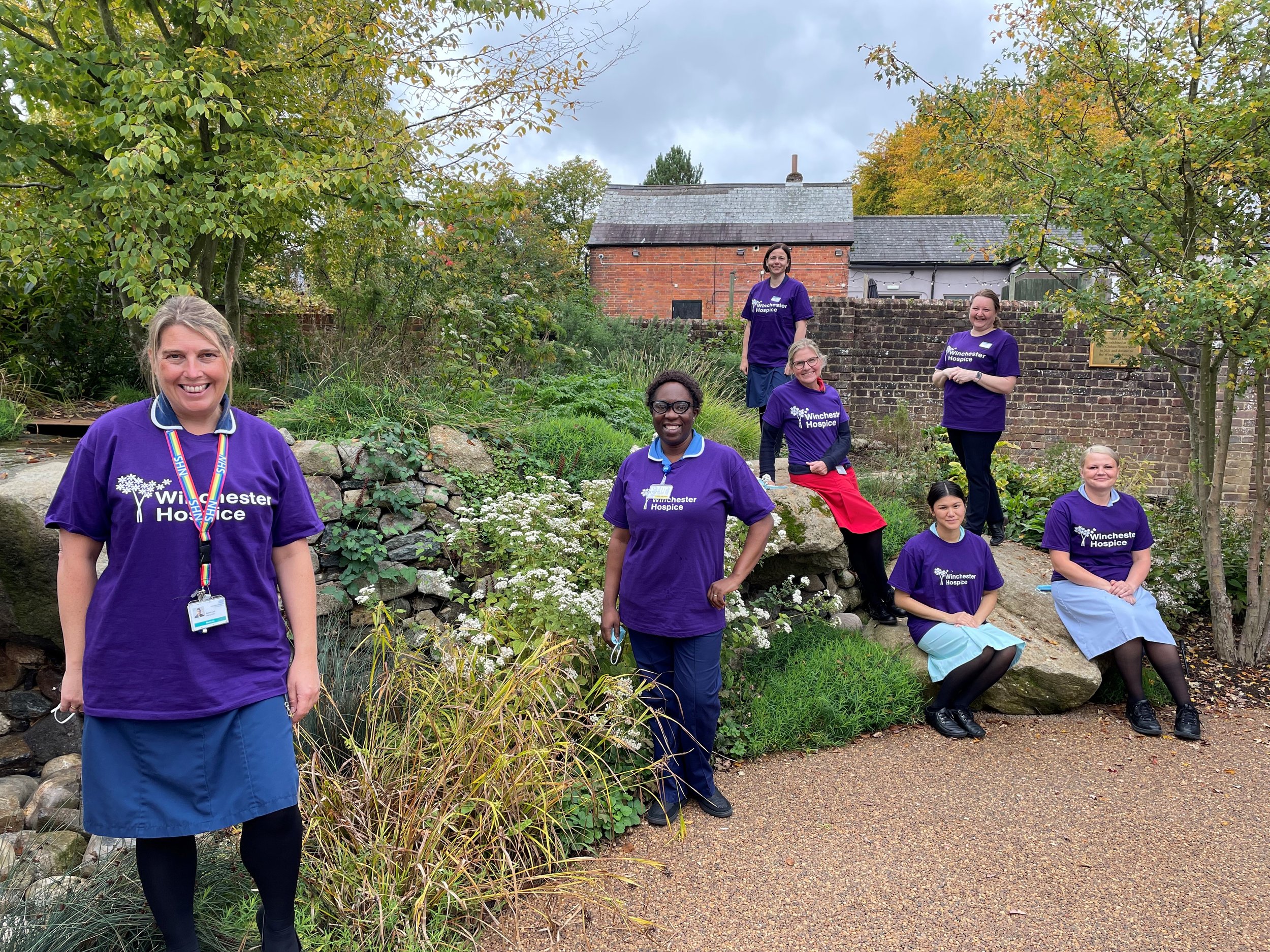  Winchester Hospice staff wearing purple in hospice garden 