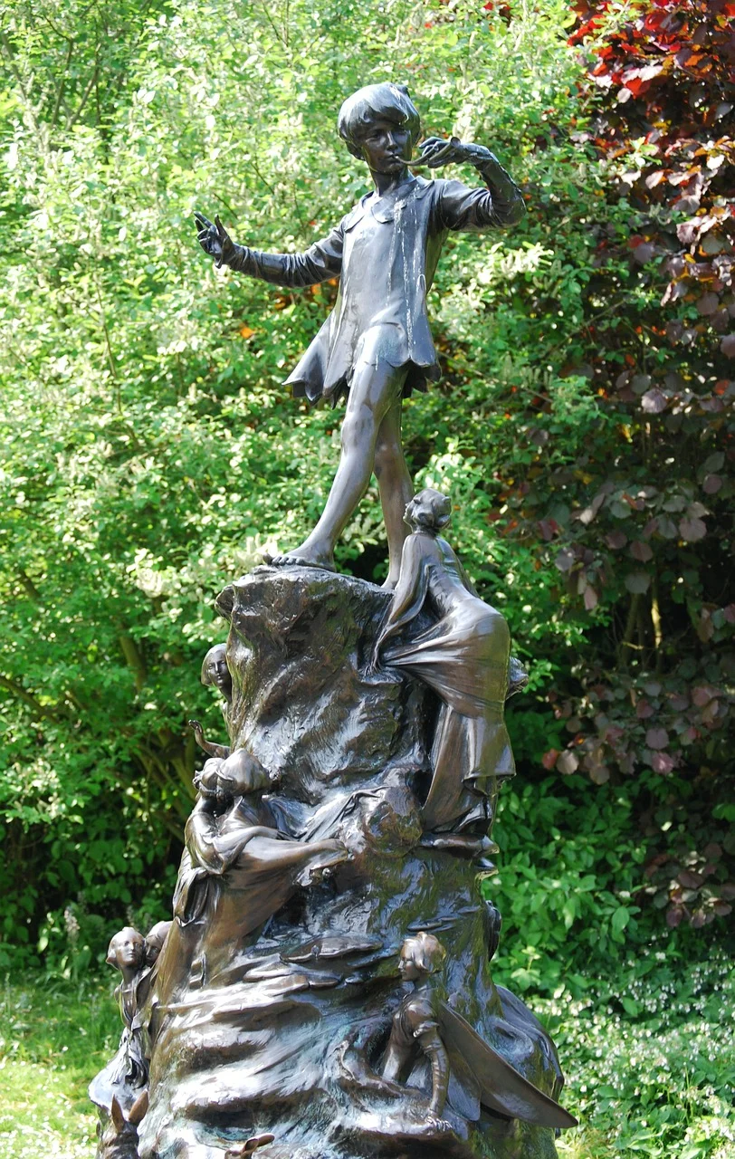 Peter Pan statue in Kensington Gardens. Image by Stevebidmead on Pixabay