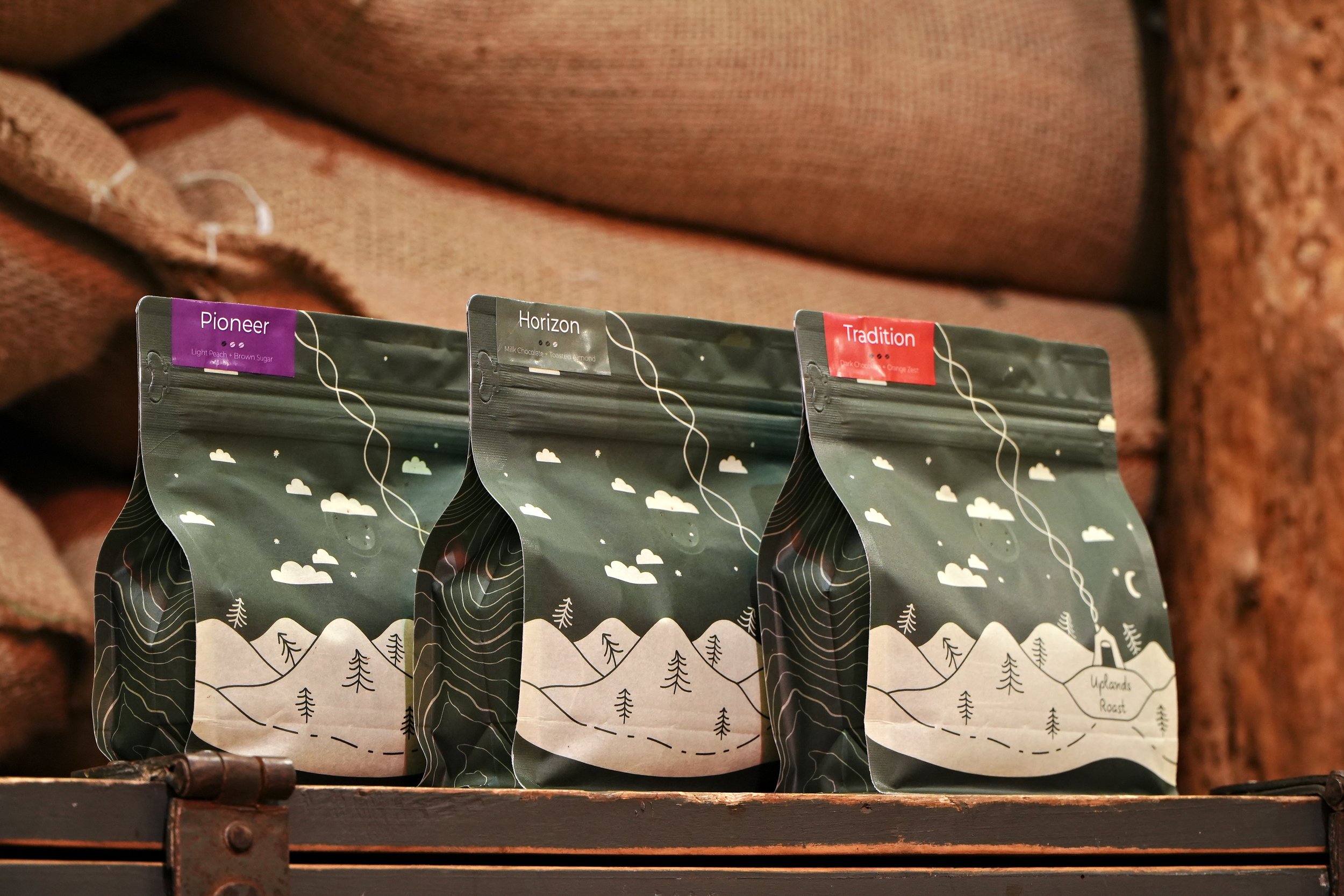 Tradition, Horizon, and Pioneer Coffees on a Table