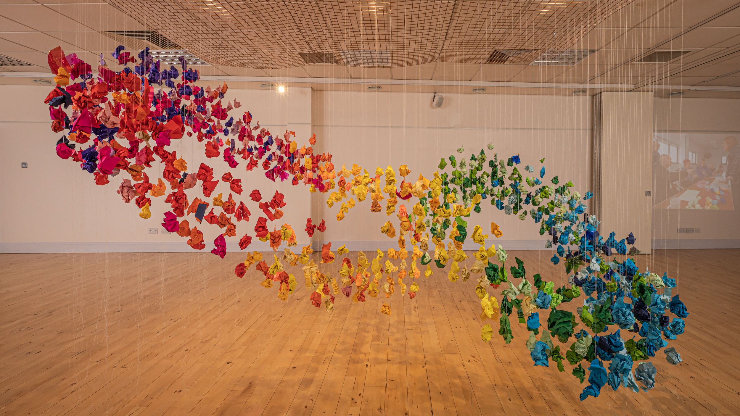  Over several months of workshops, Rachel and the participants worked to develop a way to create origami ‘brains’.&nbsp; The installation is created in loops or ripples of origami brains, representing a journey of re-framing life after acquired brain