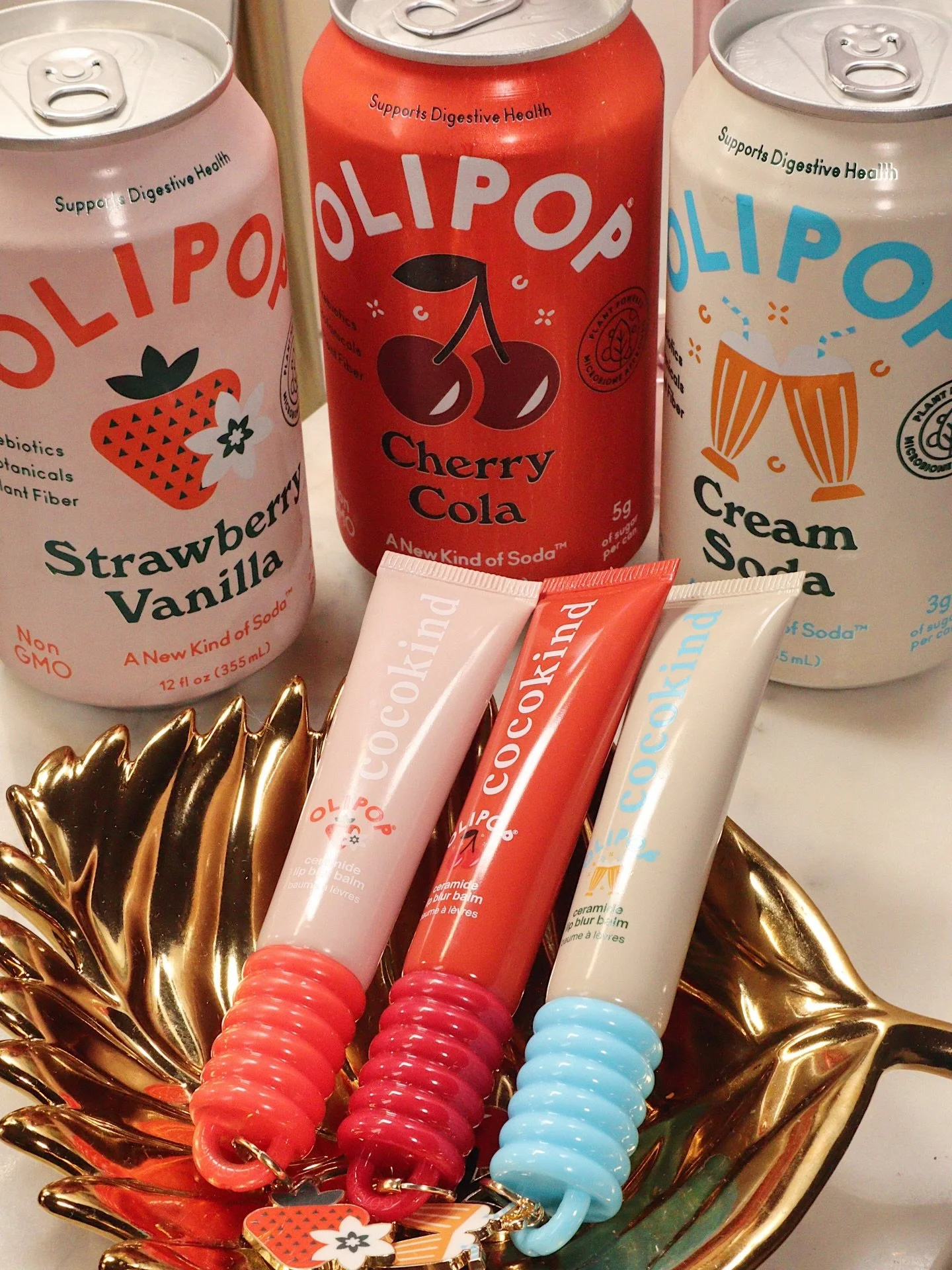 ❤️ when your lipgloss matches your drink 🥤💋 the @cocokind x @drinkolipop collab is serving nostalgic flavor vibes with glossy, hydrating shine ✨ 
⠀
𝘀𝘄𝗶𝗽𝗲 𝘁𝗵𝗿𝗼𝘂𝗴𝗵 𝘁𝗼 𝘀𝗲𝗲 𝘁𝗵𝗲 𝘀𝗵𝗮𝗱𝗲𝘀 &amp; 𝘁𝗲𝗹𝗹 𝗺𝗲 𝘆𝗼𝘂𝗿 𝗳𝗮𝘃𝗼𝗿𝗶?