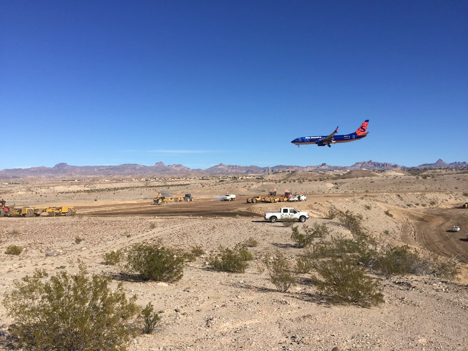 Plane over construction.JPG