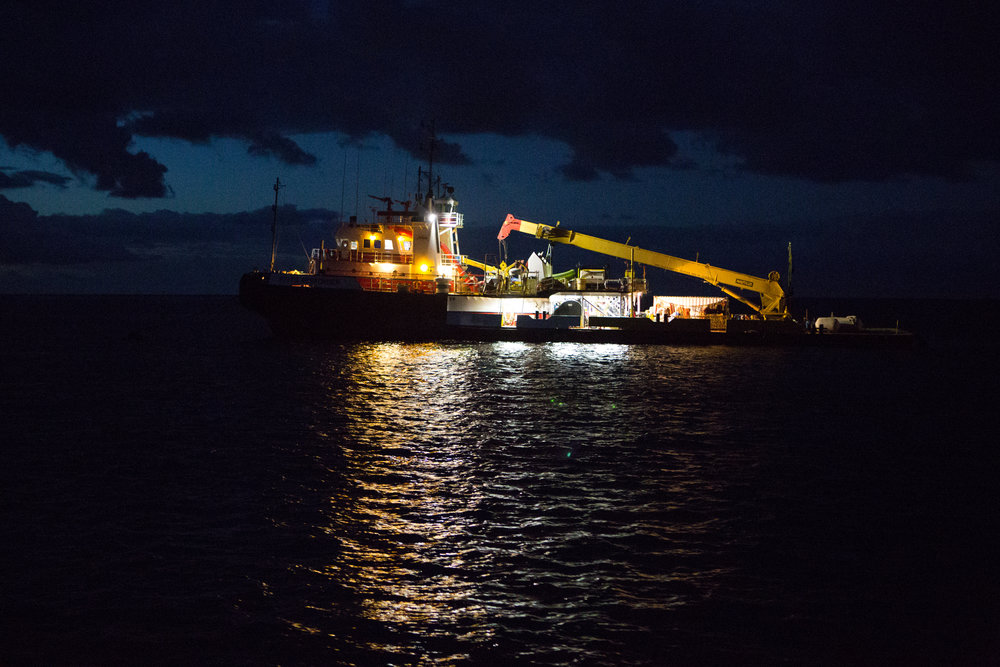 Oil tanker off the shore of Eustatia, lit by moonlight.