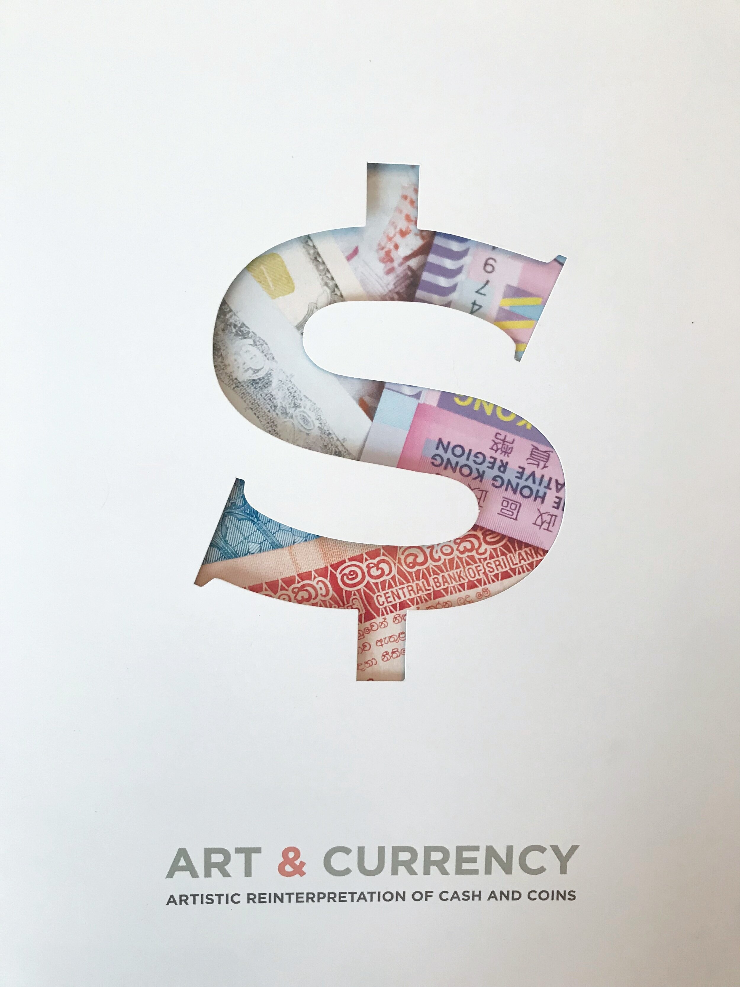   Art &amp; Currency Exhibition  |  Catalog Design  |      Detail showing die-cut cover with images of global currency on inside page.   La Colombe D’or Gallery  |  Houston, Texas  