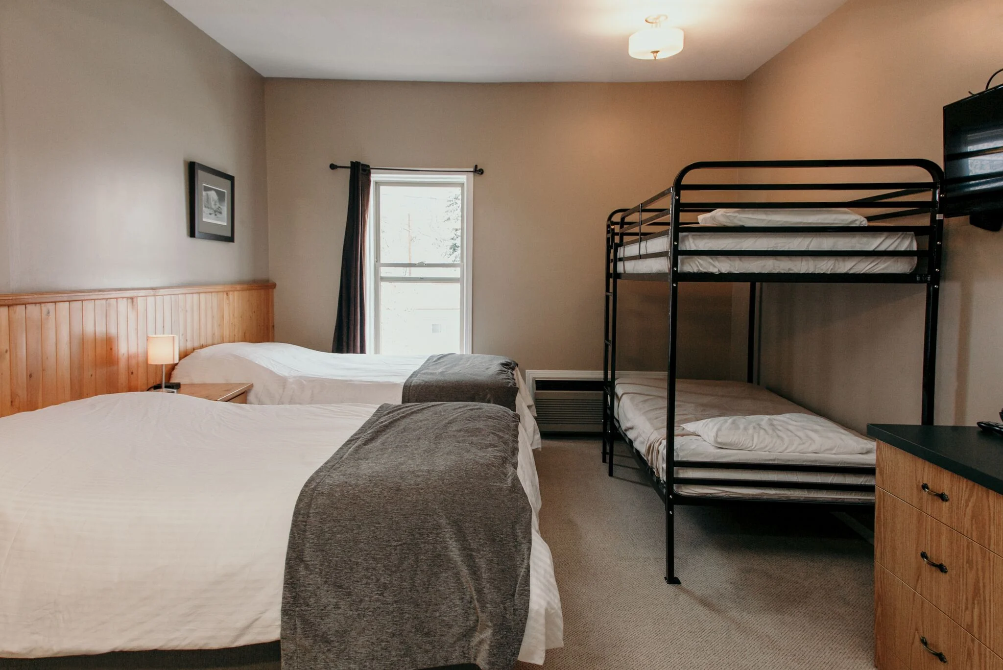 Triple Room, featuring 2 x Double Beds, a bunk bed, bathroom, coffee, and mini fridge.