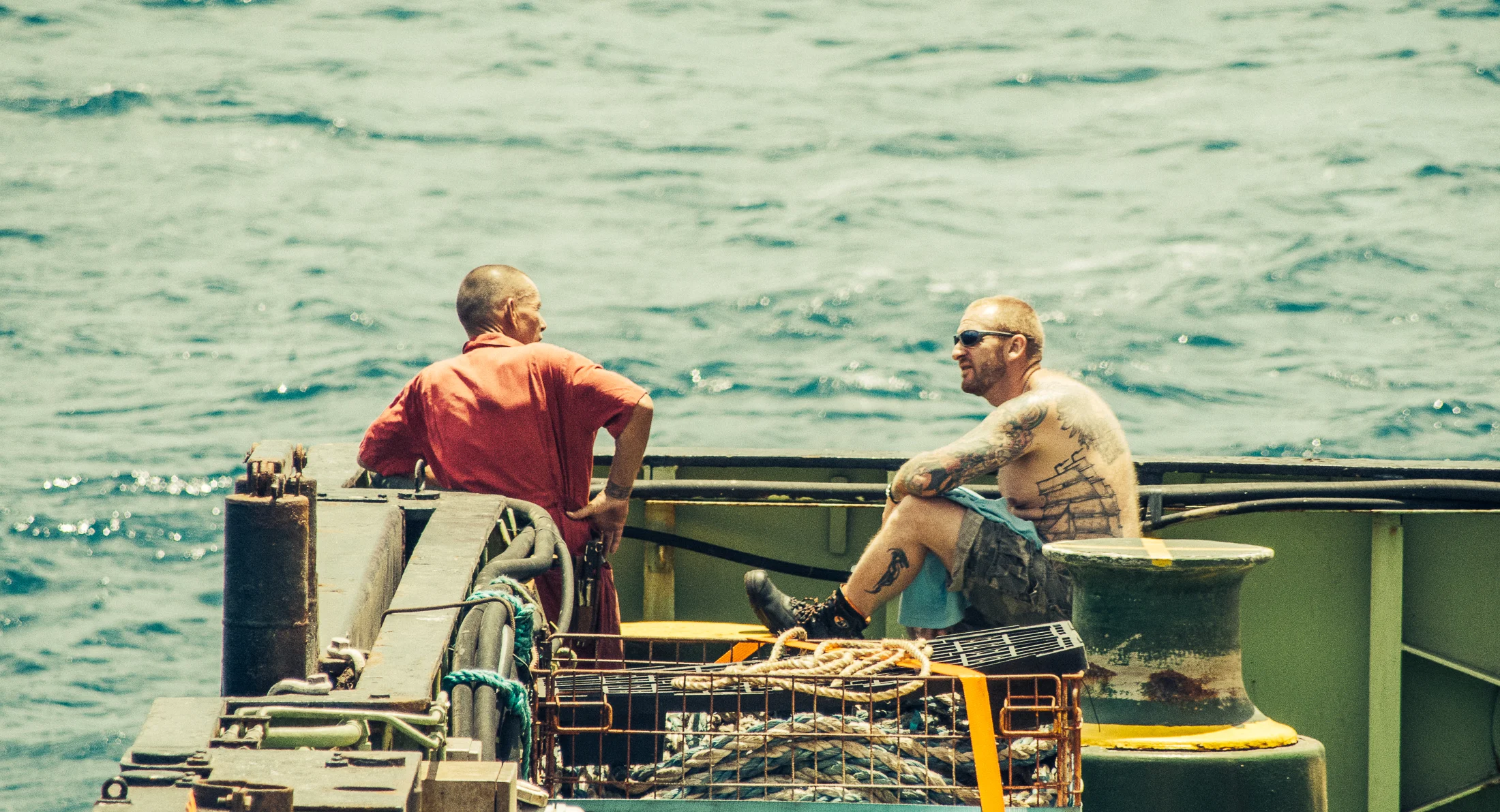 Sailors John and Marc resting during one of the few quiet moments at the deck of the ship.