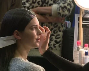 BACKSTAGE BEAUTY Before every fashion show, the models get the hair and makeup look. Discover more.