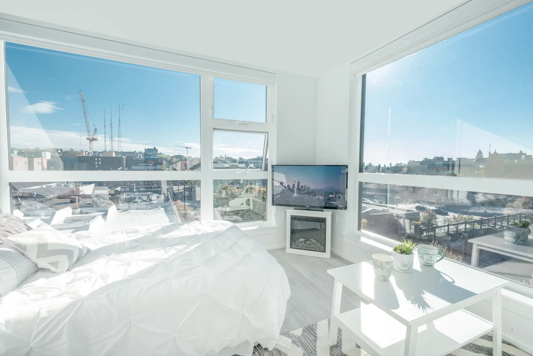 Bedroom at Pike Flats with large floor-to-ceiling windows