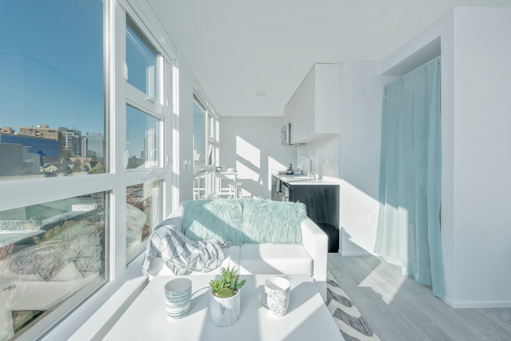 Living area at Pike Flats with white couch and coffee table