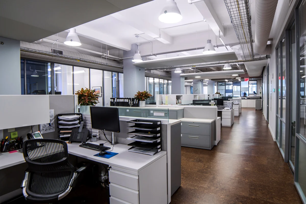 Cubicles and filing cabinets in the office space of Rockrose, a luxury real estate development firm in New York City. MEP designed by 2L Engineering.