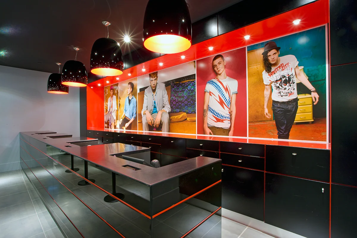 Cash registers with large posters of male models behind in the Topshop / Topman store in New York City. MEP provided by 2L Engineering.